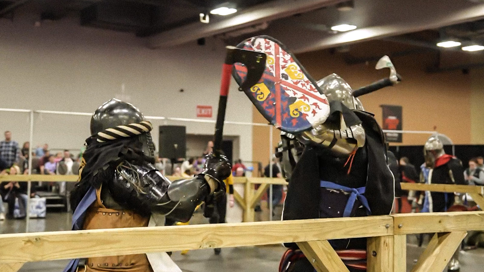 Armored League fighters mid-bout on the expo floor