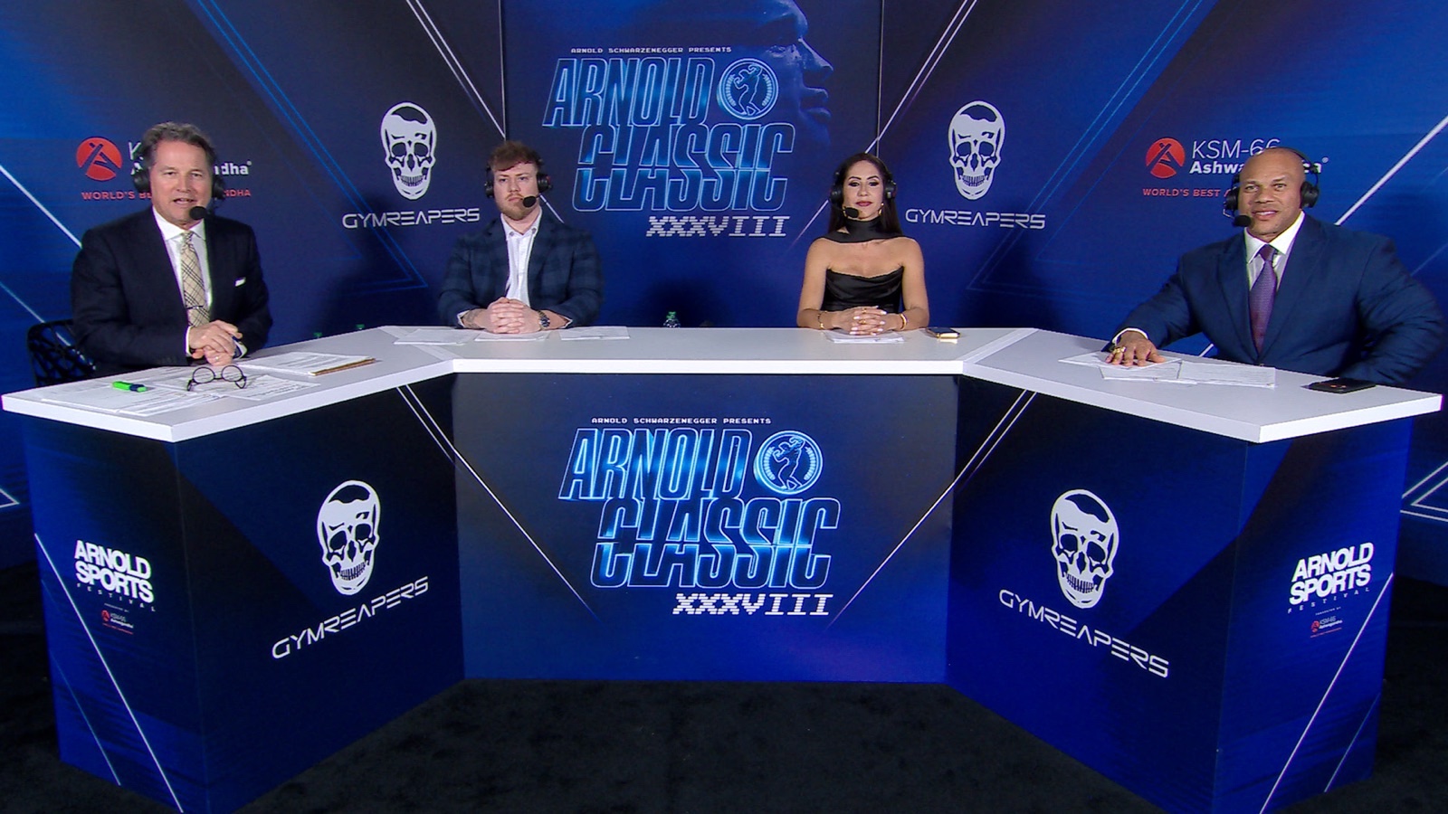 Arnold Classic livestream commentary team at the official broadcast desk
