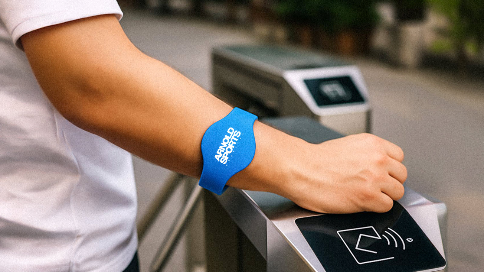Attendee tapping an RFID badge at an activation entry